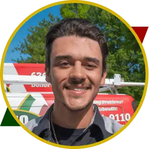 Tony Bono, plumber at Bono Plumbing, smiling in front of a service vehicle, showcasing family-owned business commitment to quality plumbing services.